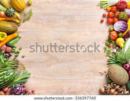 Healthy food background / studio photo of different fruits and vegetables on old wooden table. Copy spacy for your text. High resolution product