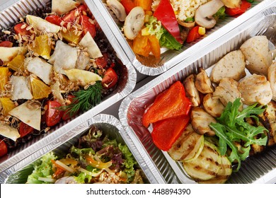 Healthy food background. Take away of natural organic food in foil boxes. Fitness nutrition, meat and vegetable salads. Top view, flat lay.