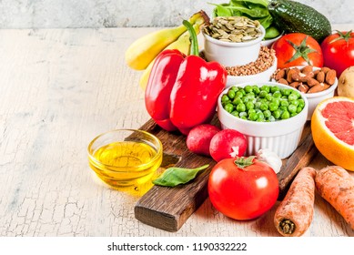 Healthy food background, trendy Alkaline diet products - fruits, vegetables, cereals, nuts. oils, light concrete background  copy space - Shutterstock ID 1190332222