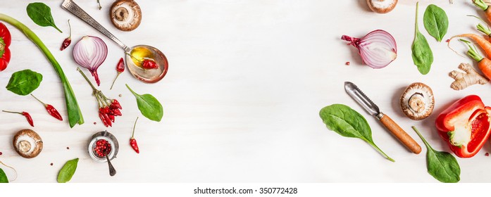 Healthy Food Background With Various Vegetables Ingredients, Spoon With Oil And Peeler, Top View