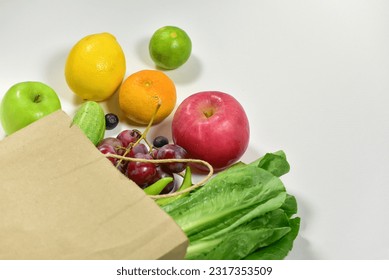 Healthy food background, healthy vegetarian food in paper bags, fruits and vegetables, banner copy space, supermarket shopping, food and clean vegetarian diet concept, organic fruits and vegetables co