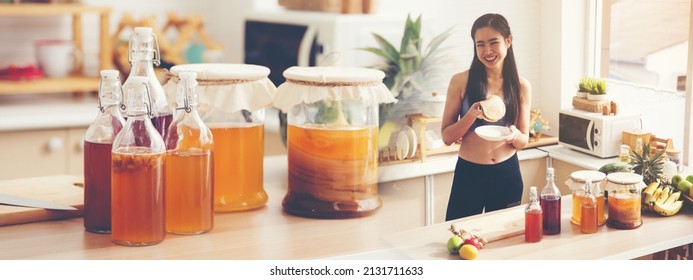 Healthy Food Banner Background, Young Asian Woman Making Kombucha Fermented Drink Processing With Bacteria And Yeast, Fermentation Of Probiotic Scoby From Mushroom Pro Biotic To Fermented Tea