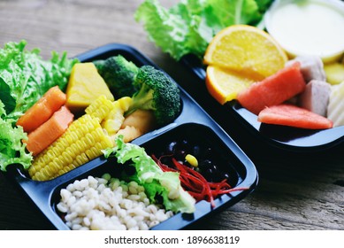 Healthy Food Box With Fruit Lettuce Vegetable Salad Sauce Service Food Order Online Delivery, Plastic Box Food Delivery In Take Away Boxes Package On Table At Home   