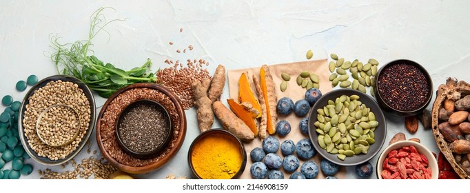 Healthy food clean eating selection on light background. Balanced diet concept. Superfood assortment. Top view, flat lay, copy space, panorama