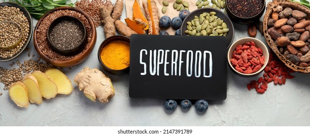 Healthy food clean eating selection on light background. Balanced diet concept. Superfood assortment. Top view, flat lay, copy space, panorama