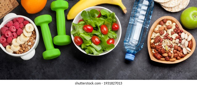 Healthy food concept. Salad, fruits, vegetables, nuts and cereal. Top view flat lay - Powered by Shutterstock
