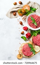 Healthy Food, Cooking Concept. Homemade Raw Organic Minced Beef Meat And Burger Steak Cutlet With Vegetables On A White Table. Copy Space Background, Top View Flat Lay