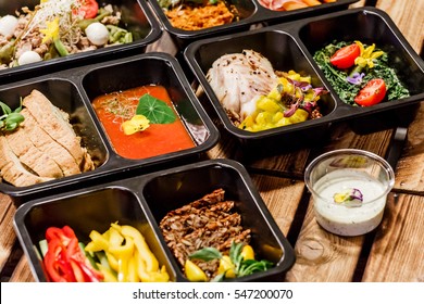 Healthy food and diet concept, restaurant dish delivery. Take away of fitness meal. Weight loss nutrition in foil boxes. 