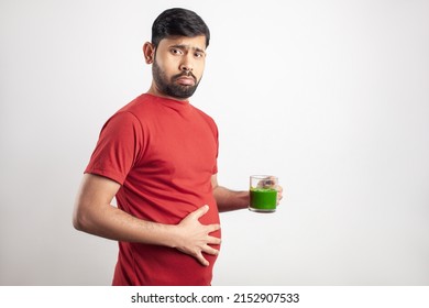 Healthy Food Eating, Fitness Concept, Keto Dieting, Overweight Man Worry About Belly Fat Drinking Vegetable Juice