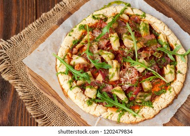 Healthy Food, Gluten Free Hawaiian Paleo Pizza Garnished With Arugula Leaves On Wooden Table