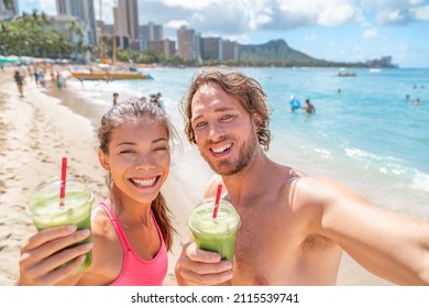 Healthy Food Happy Fit Young Couple Drinking Green Smoothie Juice Breakfast Running On Waikiki Beach, Honolulu, Hawaii Travel Vacation. Summer Lifestyle Active People