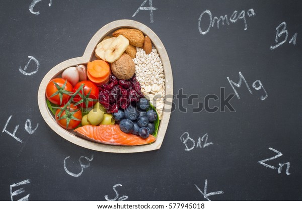 Healthy\
food in heart and chemical elements on\
blackboard