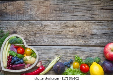Healthy food in heart diet cooking concept with fresh fruits and vegetables