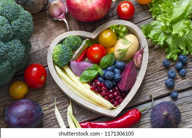 Healthy food in heart diet cooking concept with fresh fruits and vegetables
