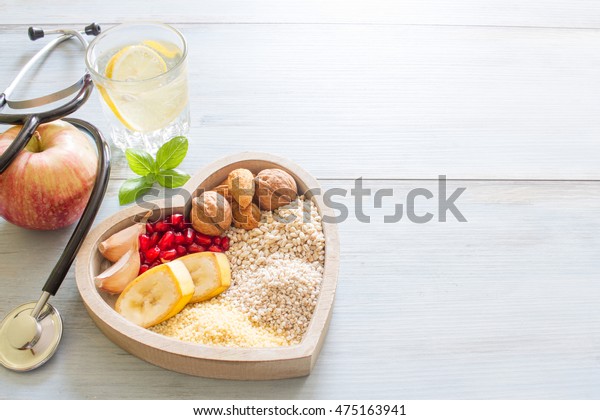 Healthy food in heart and water diet sport\
lifestyle concept