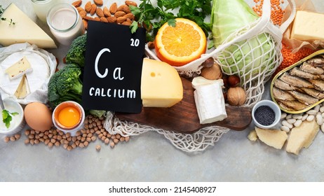Healthy food high in calcium on light background. Dairy products, vegetables and superfoods. Ca products. Top view, flat lay, copy space