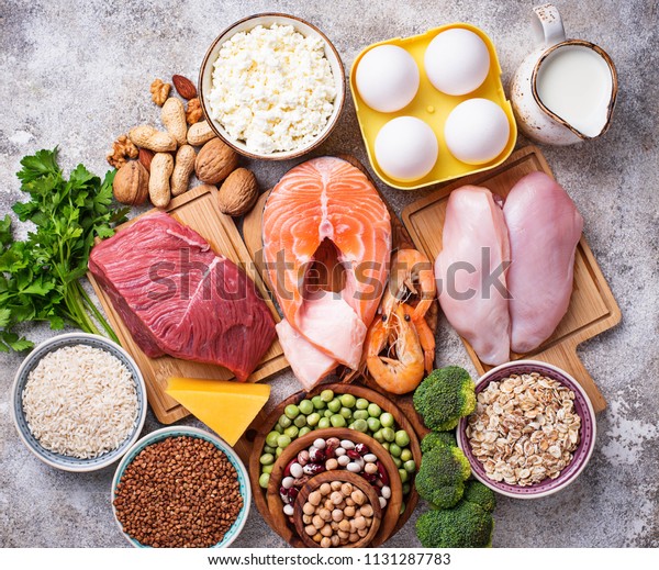 Healthy food high in protein. Meat, fish, dairy\
products, nuts and beans. Top\
view