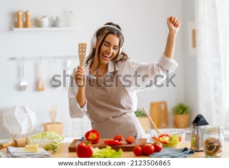Healthy food at home. Woman is preparing the proper meal in the kitchen.