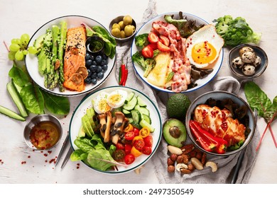 Healthy food, keto diet, diet lunch concept. Assortment of various healthy keto mealsю Top view on white background.