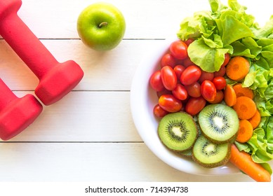 Healthy Food Lifestyle For Women Diet With Gym Activity Personal Athlete Sport Exercise Equipment, Vegetable And Fruits Fresh, Green Apples On White Wooden.  Diet And Health Life Concept