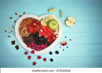 Healthy food on wooden table. Heart health concept