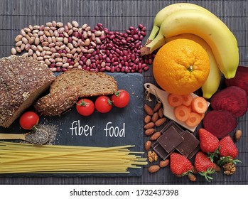 Healthy Food Rich In Fiber. Fiber High Food. Natural Sources Of Fiber: Almond, Strawberry, Banana, Dark Chocolate, Cherry Tomato, Whole Grain Bread, Spaghetti, Chia, Beetroot, Carrot, Bean, Orange.