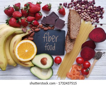 Healthy Food Rich In Fiber. Fiber High Food. Natural Sources Of Fiber: Almond, Strawberry, Banana, Dark Chocolate, Cherry Tomato, Whole Grain Bread, Spaghetti, Chia, Beetroot, Bean, Orange, Avocado.