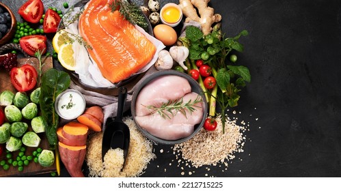 Healthy Food Selection On Dark Background. Detox And Clean Diet Concept. Foods High In Vitamins, Minerals And Antioxidants. Anti Age Foods. Top View. Panorama With Copy Space.