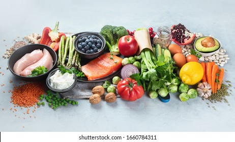 Healthy Food Selection On Gray Background. Detox And Clean Diet Concept. Foods High In Vitamins, Minerals And Antioxidants. Anti Age Foods. Image With Copy Space