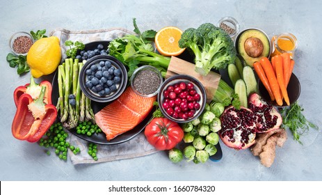 Healthy Food Selection On Gray Background. Detox And Clean Diet Concept. Foods High In Vitamins, Minerals And Antioxidants. Anti Age Foods. Top View