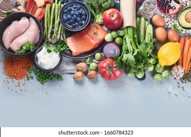 Healthy Food Selection On Gray Background. Detox And Clean Diet Concept. Foods High In Vitamins, Minerals And Antioxidants. Anti Age Foods. Top View With Copy Space