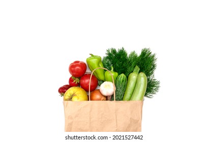 Healthy food in a shopping bag, fruits in a paper bag on a white isolated background. Vegetarian food delivery. Concept for grocery shopping, home delivery of groceries, top view, copy space. Flat lay - Shutterstock ID 2021527442
