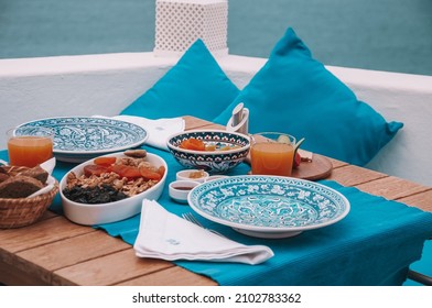 Healthy Food Table Setting For Two. Blue View. Healthy And Colorful Mediterranean Diet Breakfast