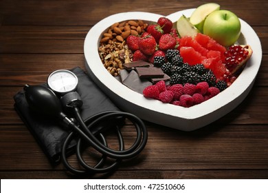 Healthy Food With Tonometer On Table. Heart Health Concept