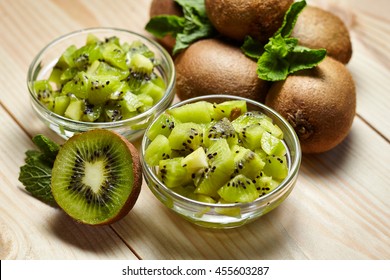 Healthy food. Tropical fruit. Whole and sliced kiwi. Kiwi fruit. Still life. Juicy kiwi on the wooden table - Shutterstock ID 455603287