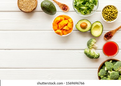 Healthy food. Vegatables and fruits on white wooden background top view frame copy space