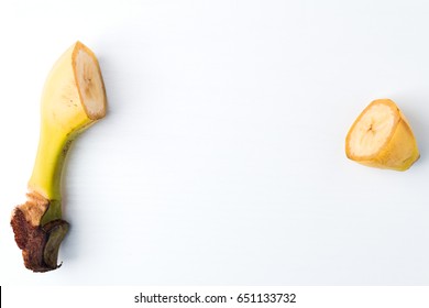 Healthy Food And Vitamins: Sliced Ripe Banana With A Slice Of The Beginning And End Without The Middle On A White Table With Space For Text