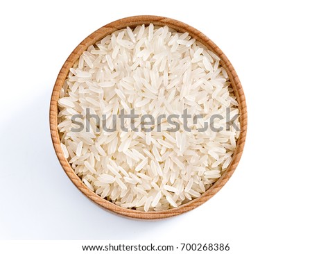 Healthy food. Wooden bowl with parboiled rice on white background. Top view, copy space, high resolution product.