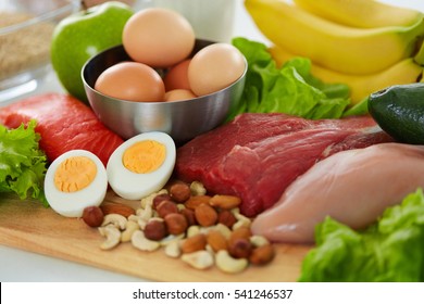 Healthy Foods. Assortment Of Different Food Products On Table. Closeup Of Fresh Organic Vegetables, Variety Of Meats On Kitchen Countertop. Nutrition Concept. High Resolution