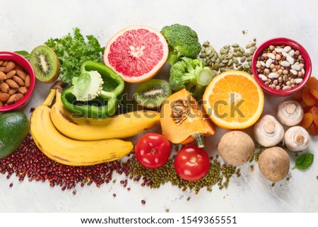 Healthy foods high in potassium. Products containing  vitamins, antioxidants and micronutrients for healthy balanced diet. Top view, flat lay with copy space