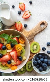 Healthy Fresh Fruit Salad In A Bowl On Wooden Background