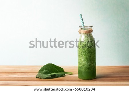 Similar – Foto Bild Grünkohl Smoothie im Glas auf weißem Holzgrund.