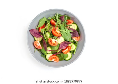 Healthy Fresh Salad Of Vegetable Cucumber, Tomato, Spinach, Arugula In Plate On White Background. Food Background For Menu, Recipe. Top View