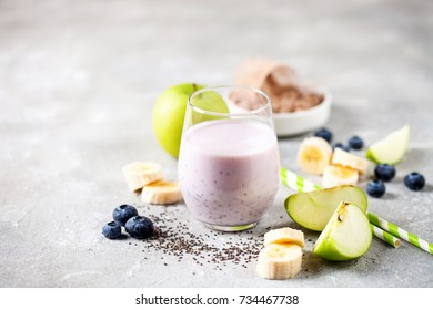 Healthy Fresh Smoothie Drink From Green Apple, Banana, Chia Seeds And Plant Protein Powder In The Glass. Selective Focus