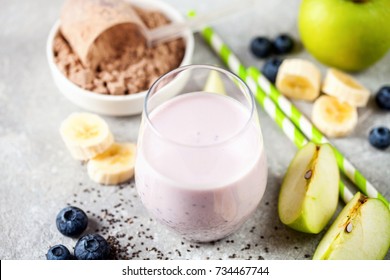 Healthy Fresh Smoothie Drink From Green Apple, Banana, Chia Seeds And Plant Protein Powder In The Glass. Selective Focus