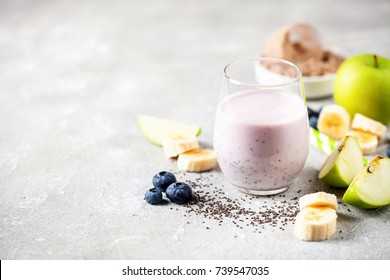 Healthy Fresh Smoothie Drink From Green Apple, Banana, Chia Seeds And Plant Protein Powder In The Glass. Selective Focus