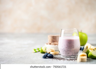 Healthy Fresh Smoothie Drink From Green Apple, Banana, Chia Seeds And Plant Protein Powder In The Glass. Selective Focus