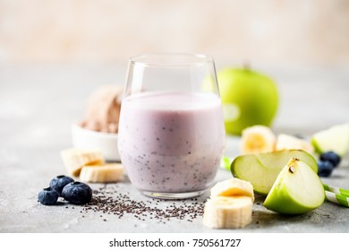 Healthy Fresh Smoothie Drink From Green Apple, Banana, Chia Seeds And Plant Protein Powder In The Glass. Selective Focus