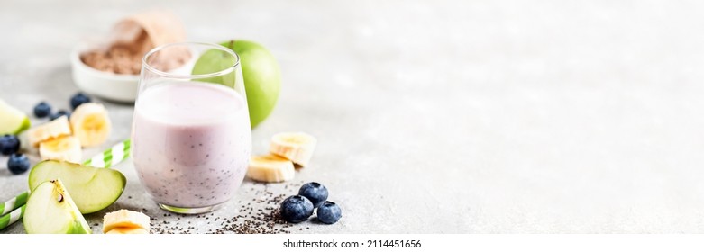 Healthy Fresh Smoothie Drink From Whey Protein Powder, Green Apple, Banana, Chia Seeds In The Glass. Copy Space, Banner