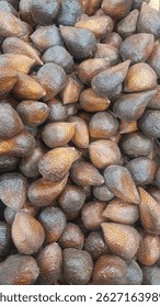 healthy and fresh snakefruit neatly arranged for sale in the market. healthy and fresh fruit backgroun